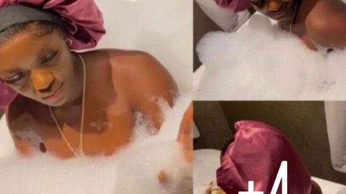 Omo your photographer is careful not to be seen, he deserves an award- Luchy Donalds stirs reactions as she share Bathtub video